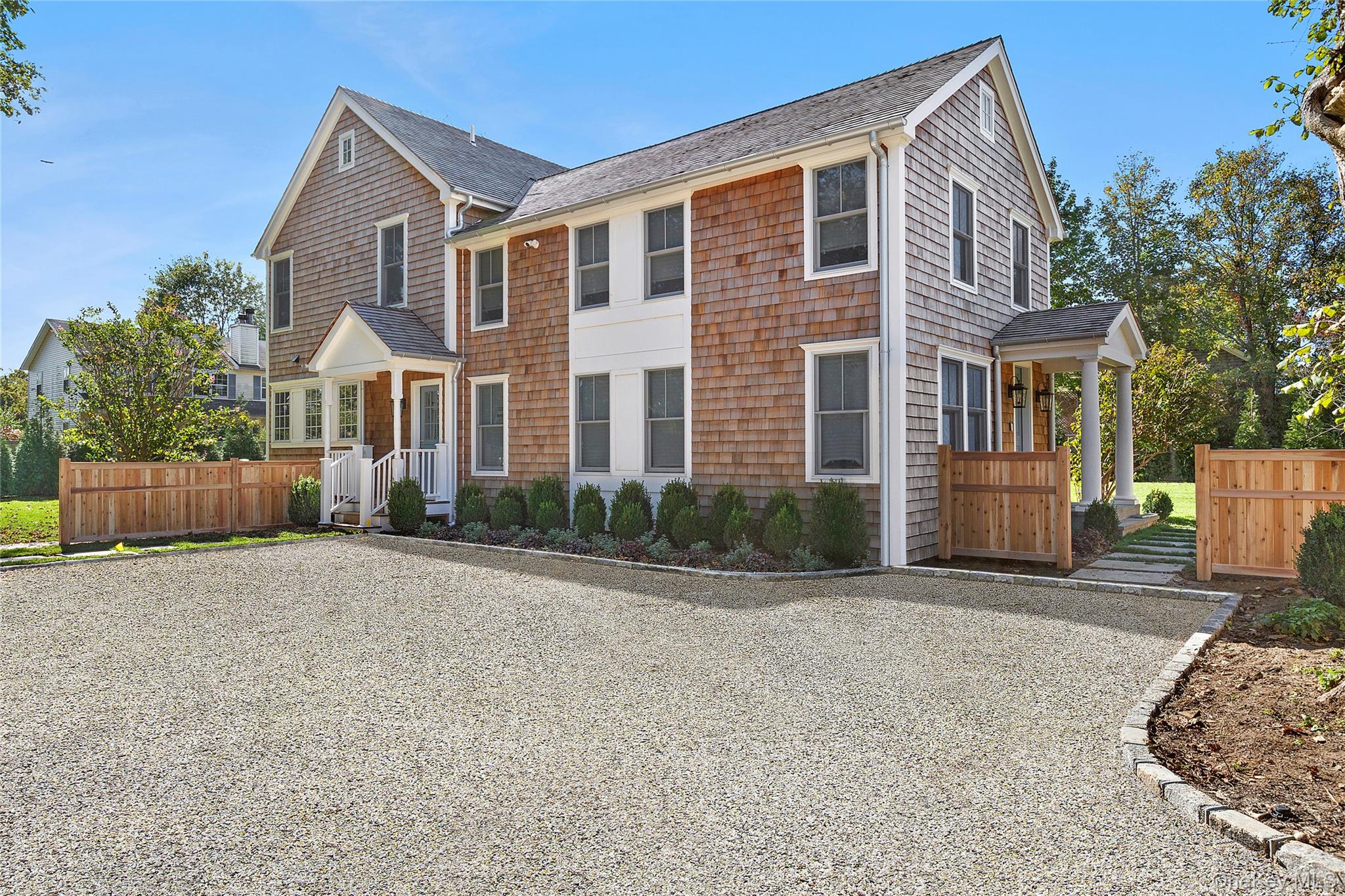 96 Miller Road Southampton, NY 11968 - Photo 2 of 18 a front view of a house with a yard