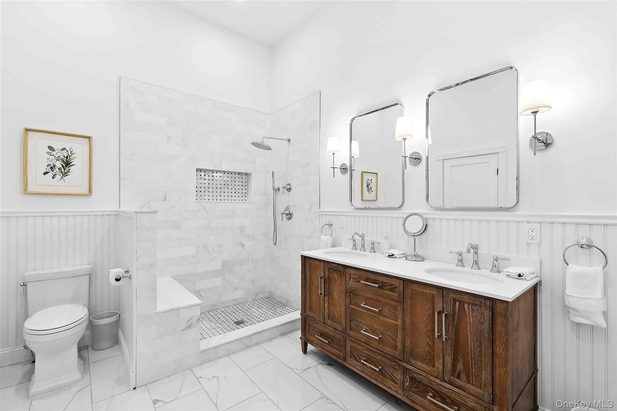 96 Miller Road Southampton, NY 11968 - Photo 7 of 18 a spacious bathroom with a double vanity sink mirror and toilet