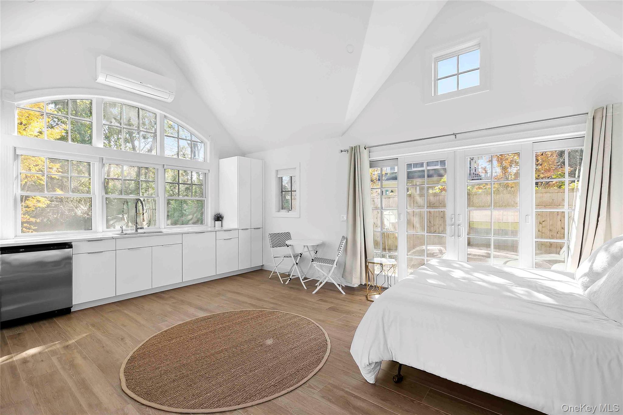 96 Miller Road Southampton, NY 11968 - Photo 8 of 18 a room with a bed and a large window