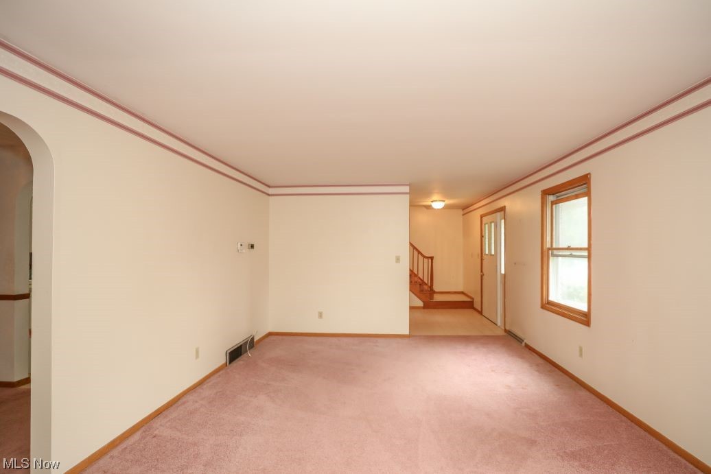3143 Sandy Lake Road Ravenna, OH 44266 - Photo 14 of 35 Unfurnished room featuring ornamental molding and light carpet
