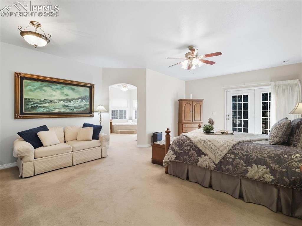 12855 Murphy Road Elbert, CO 80106 - Photo 14 of 50 a bedroom with a large bed couch and a window