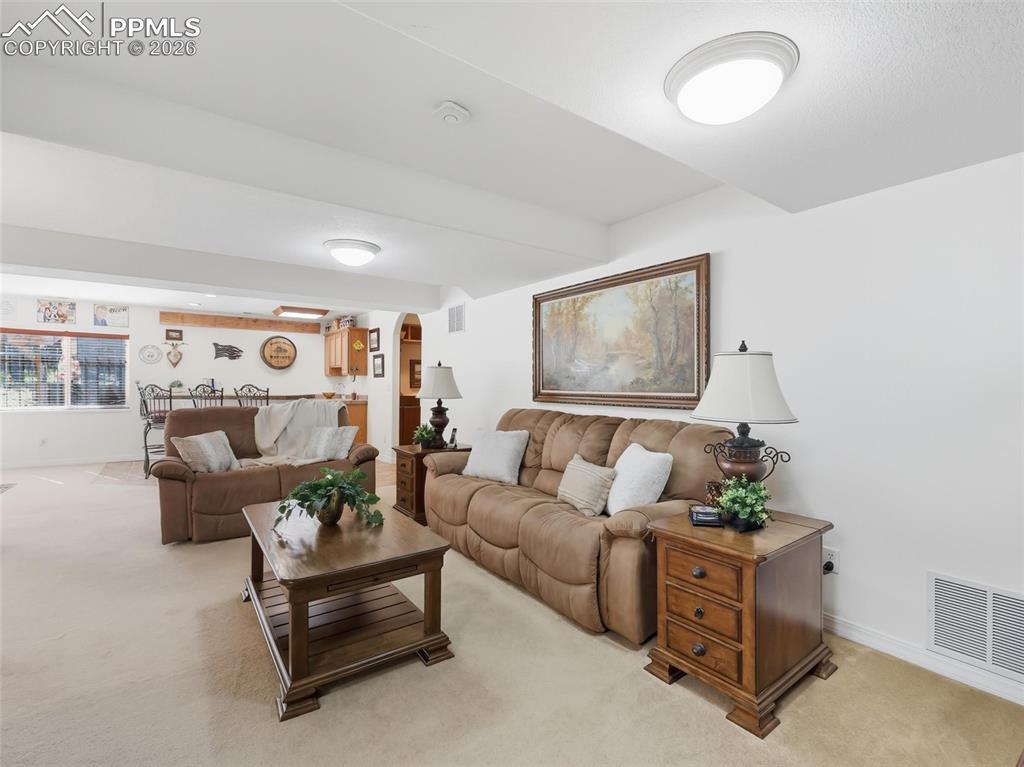 12855 Murphy Road Elbert, CO 80106 - Photo 27 of 50 a living room with furniture and a painting on the wall