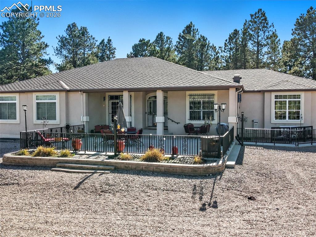 12855 Murphy Road Elbert, CO 80106 - Photo 46 of 50 a backyard of a house with yard fire pit and outdoor seating