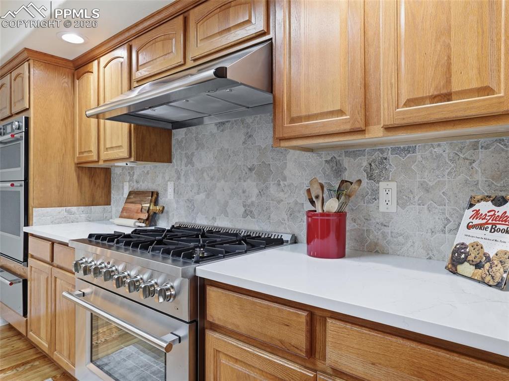 12855 Murphy Road Elbert, CO 80106 - Photo 7 of 50 a kitchen with stainless steel appliances granite countertop a stove and a cabinets