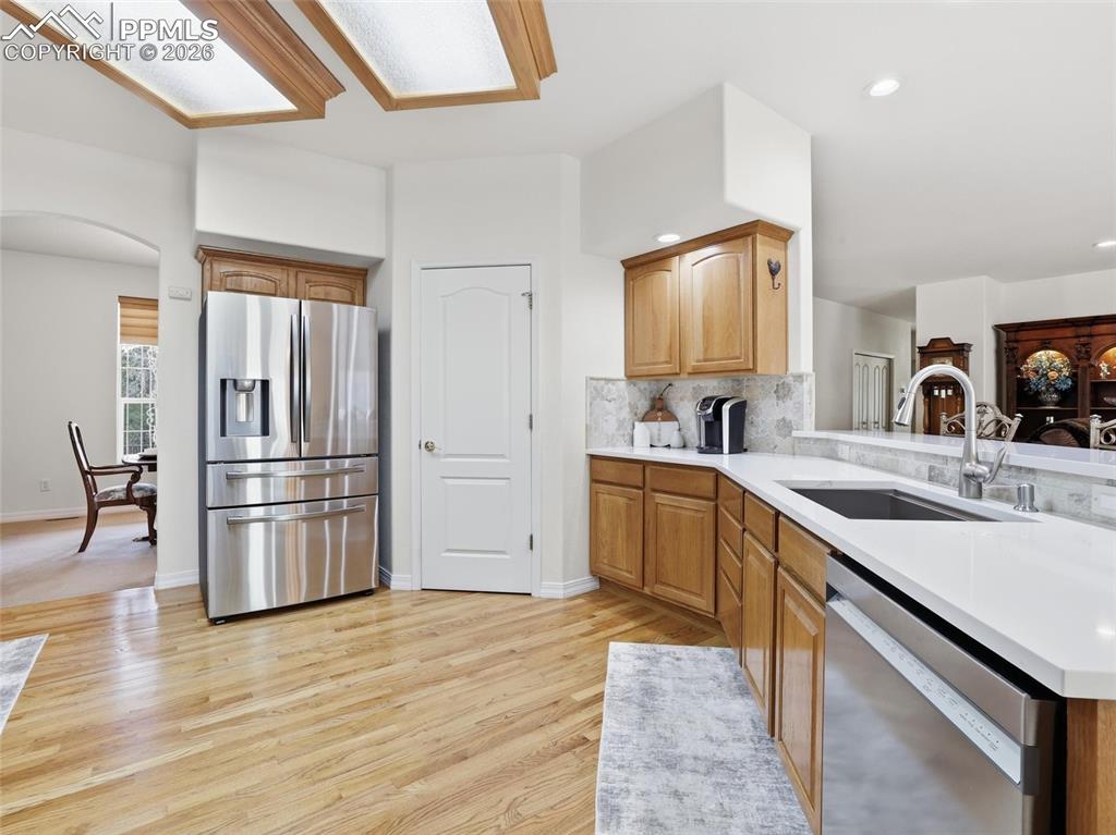 12855 Murphy Road Elbert, CO 80106 - Photo 8 of 50 a kitchen with stainless steel appliances granite countertop a refrigerator and a sink