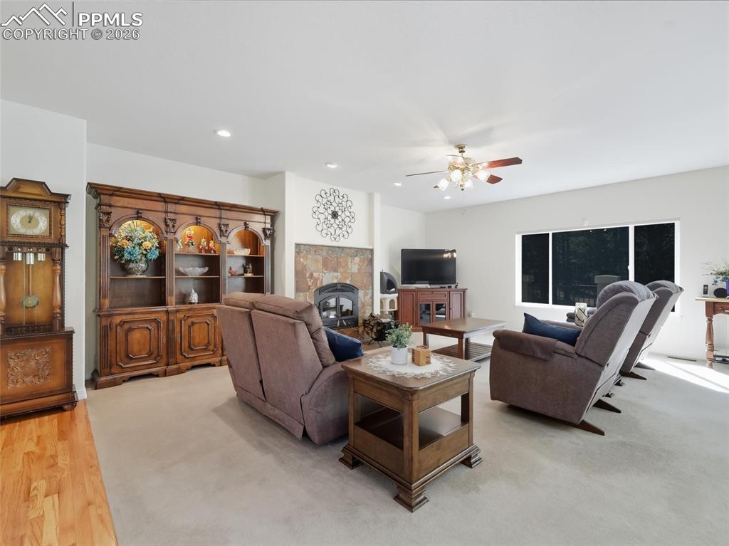 12855 Murphy Road Elbert, CO 80106 - Photo 10 of 50 a living room with furniture and a flat screen tv