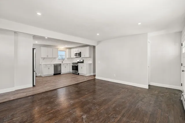 a view of a kitchen with a sink and a stove top oven