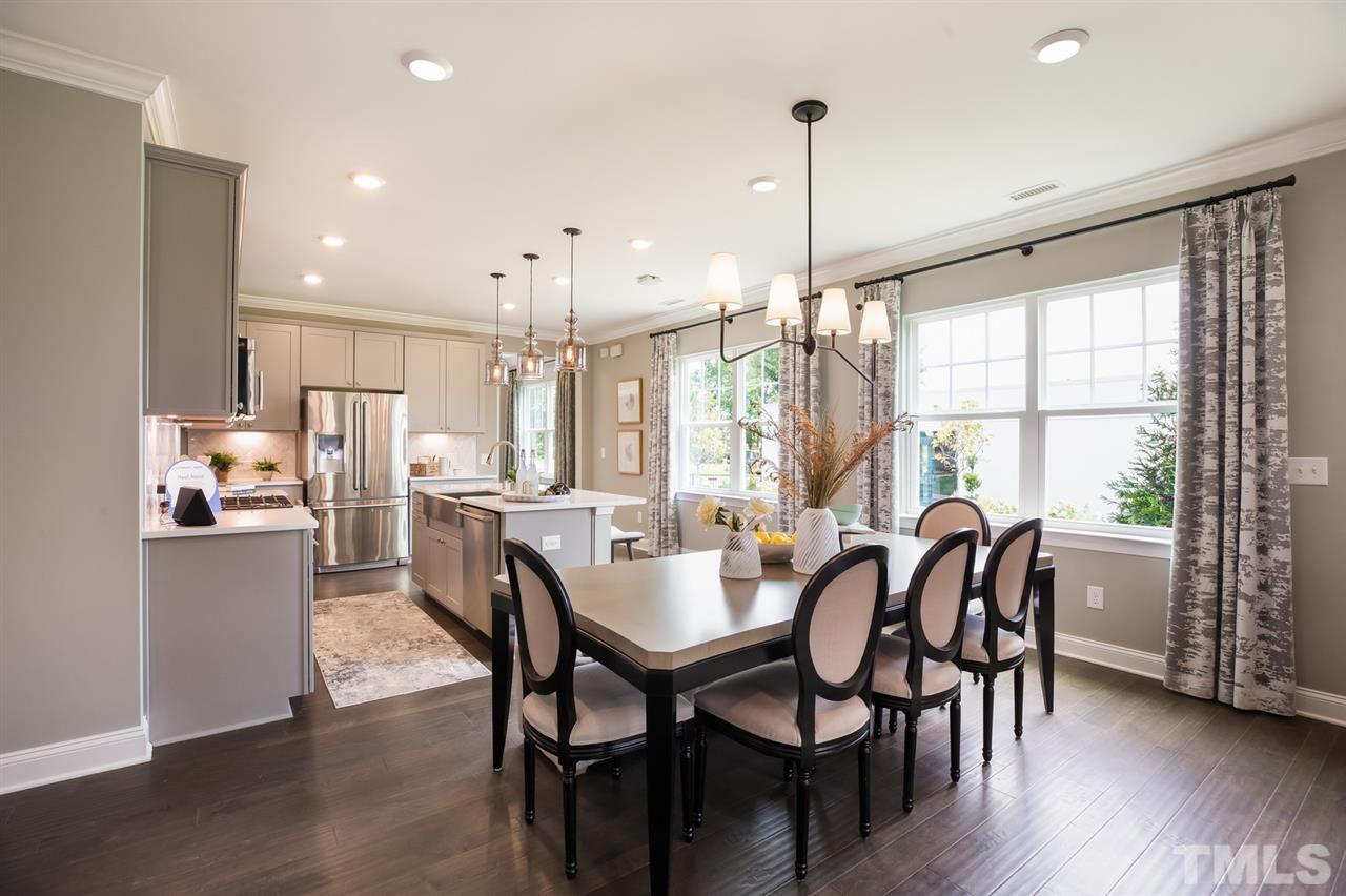 244 Mahogany Run, Unit 192 Raleigh, NC 27610 - Photo 17 of 30 a dining room with furniture and window