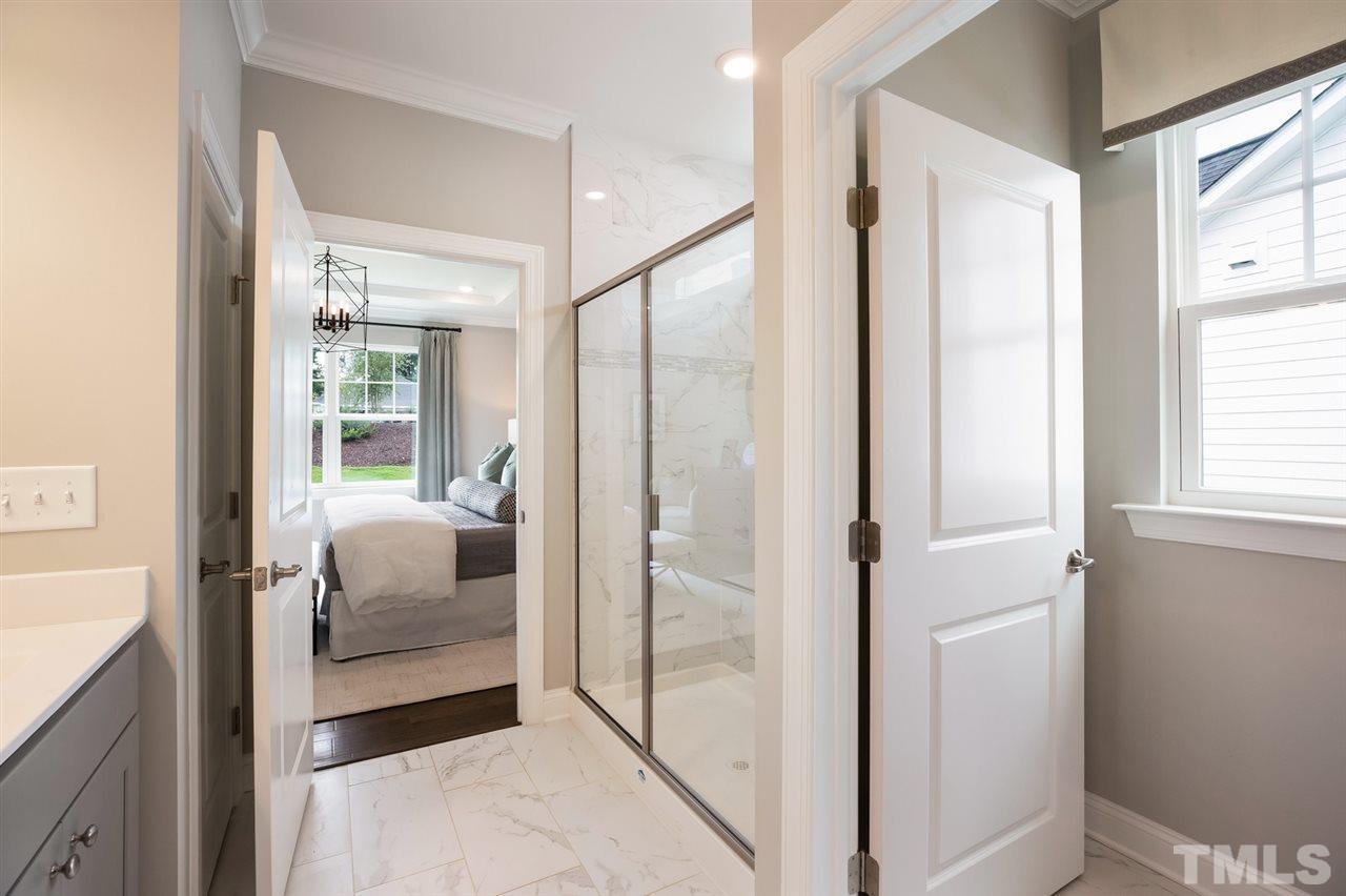 244 Mahogany Run, Unit 192 Raleigh, NC 27610 - Photo 22 of 30 a bedroom with a bed and a window