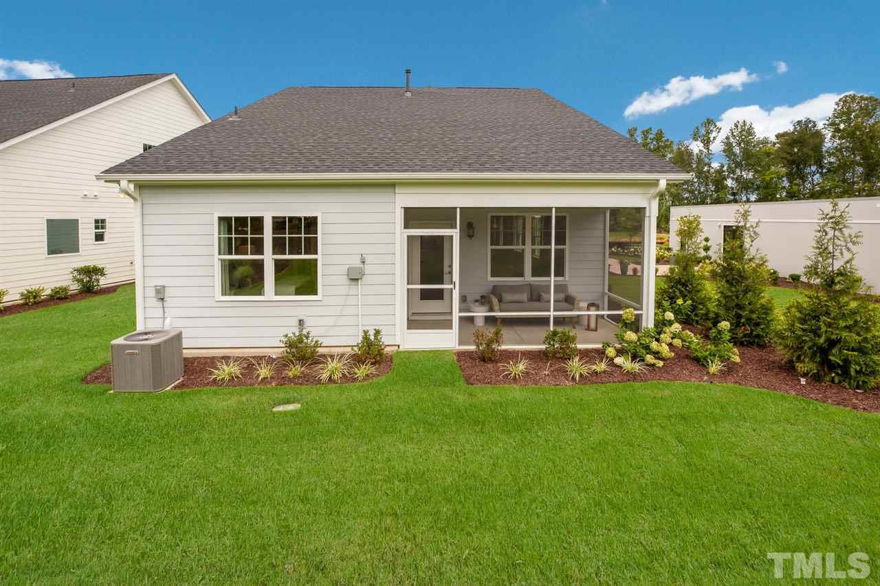 244 Mahogany Run, Unit 192 Raleigh, NC 27610 - Photo 27 of 30 a front view of house with yard and outdoor seating