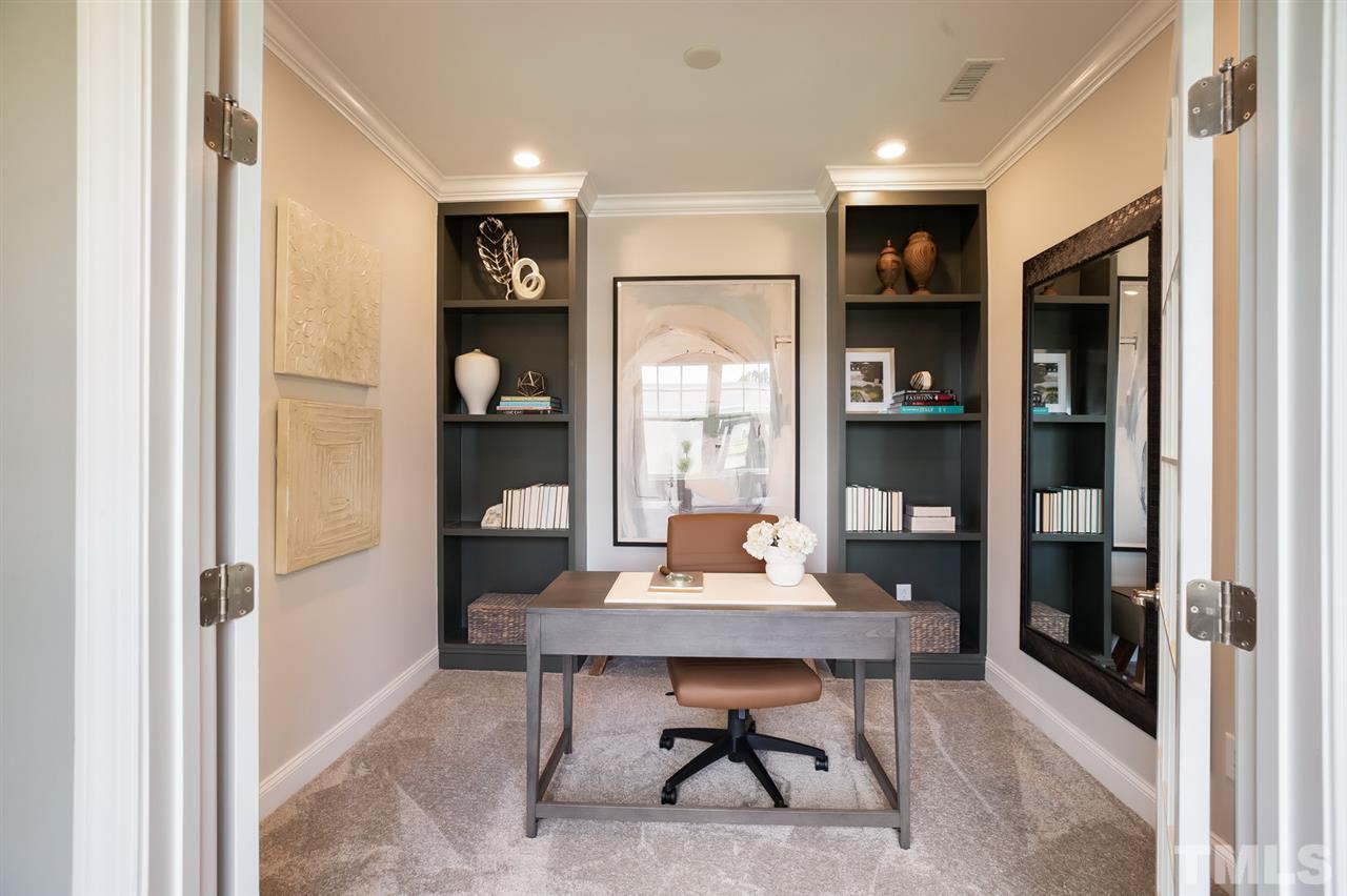 244 Mahogany Run, Unit 192 Raleigh, NC 27610 - Photo 7 of 30 a view of a dining room with a table and chairs