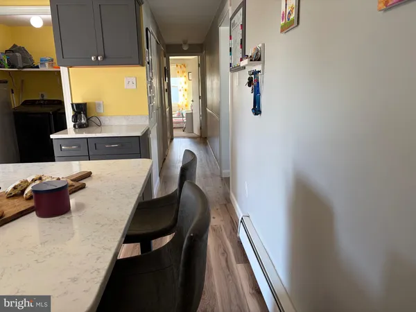 a dining room with furniture and a window