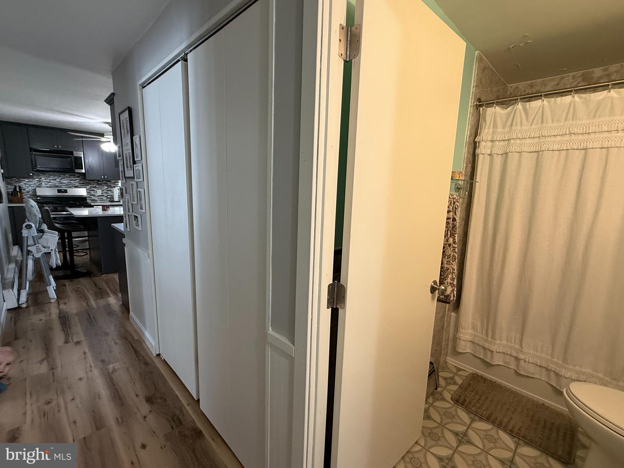 12 North Maple Avenue Ridgely, MD 21660 - Photo 15 of 23 a view of a hallway with wooden floor and furniture