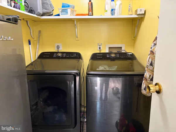 a utility room with dryer and washer