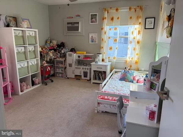 a bed room with a bed and a desk