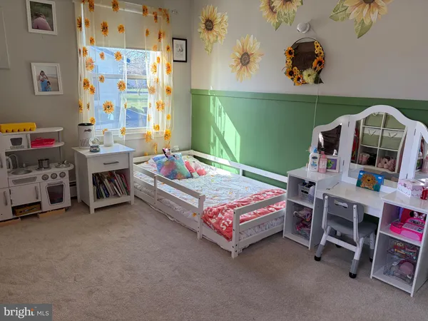 a bedroom with a bed and a bookshelf