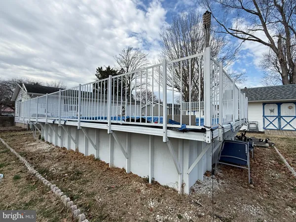a view of a swimming pool with outdoor seating