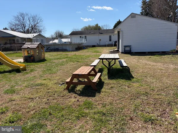 a car parked in the backyard of a house