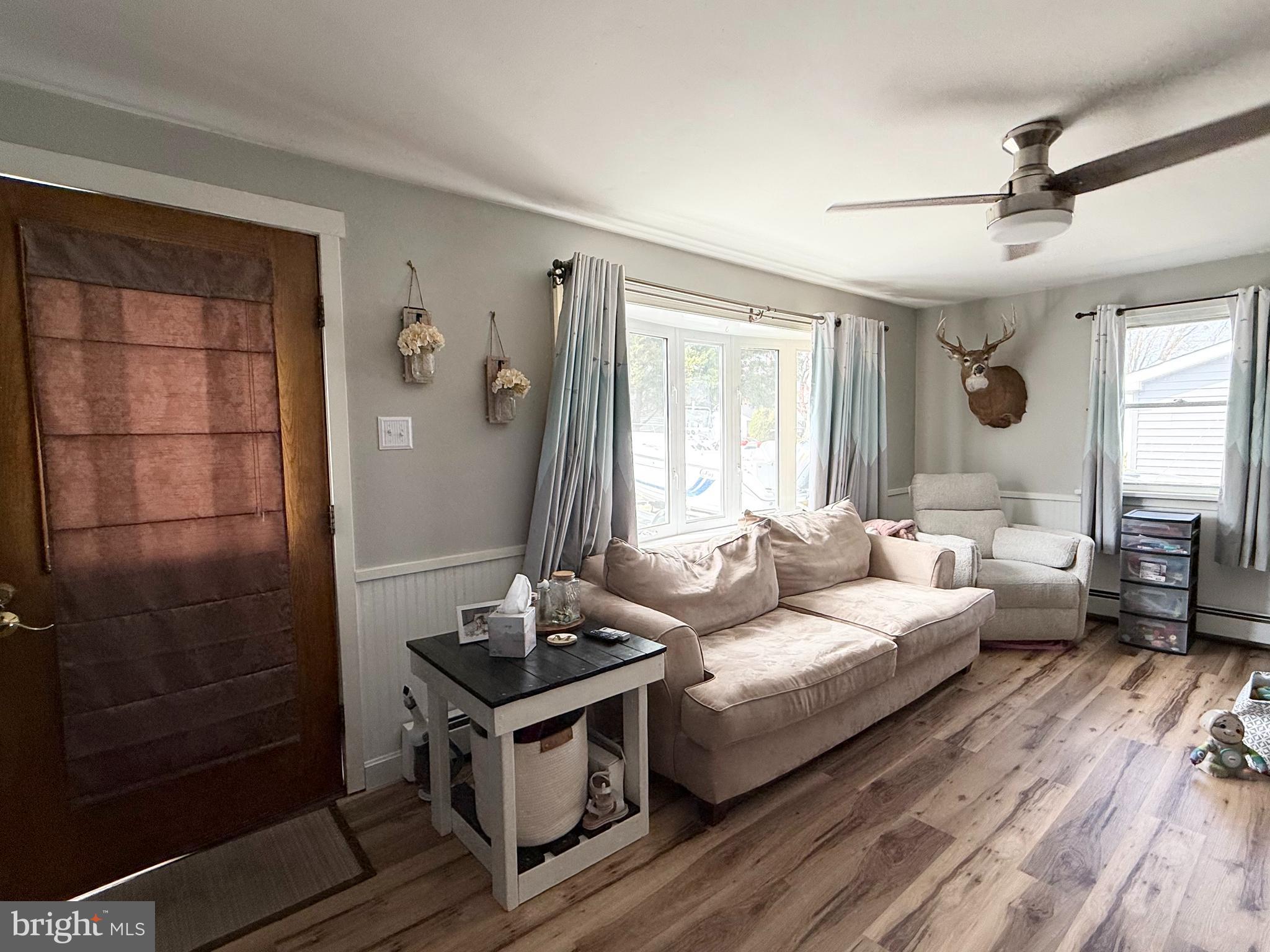 12 North Maple Avenue Ridgely, MD 21660 - Photo 4 of 23 a living room with furniture and a window