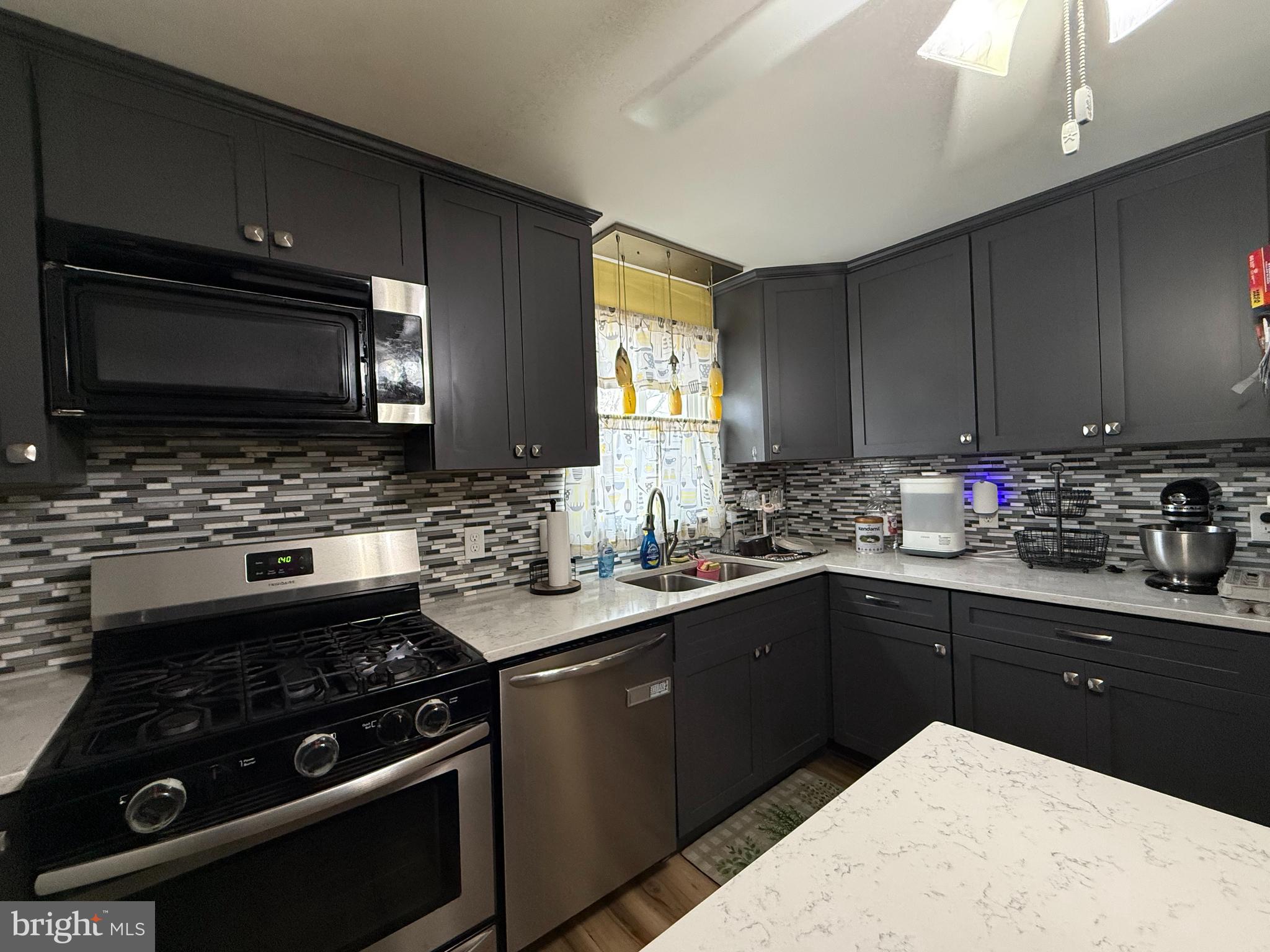 12 North Maple Avenue Ridgely, MD 21660 - Photo 7 of 23 a kitchen with a sink stove and microwave