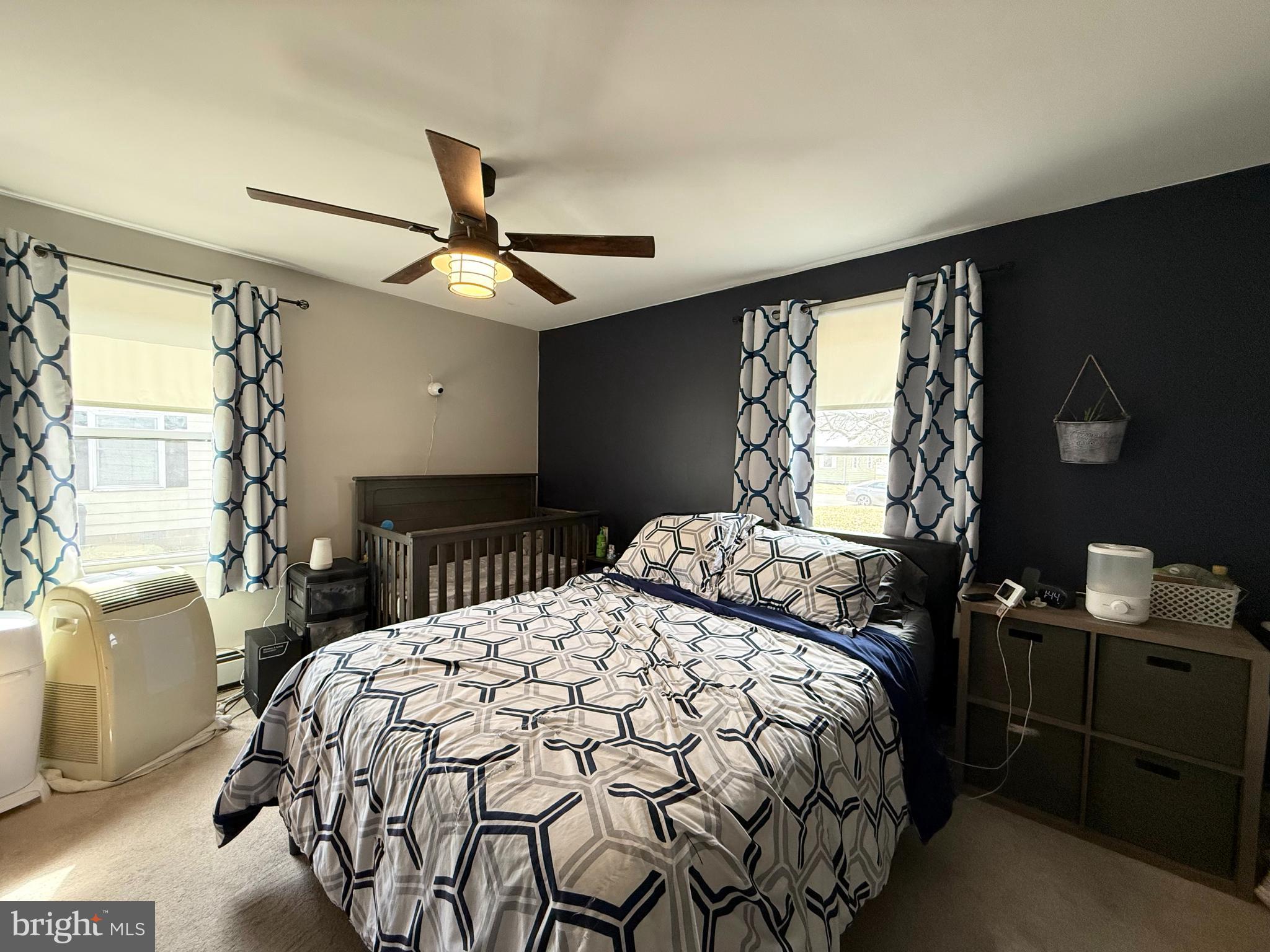 12 North Maple Avenue Ridgely, MD 21660 - Photo 8 of 23 a bedroom with a bed and a chandelier