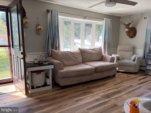 a living room with furniture and a window