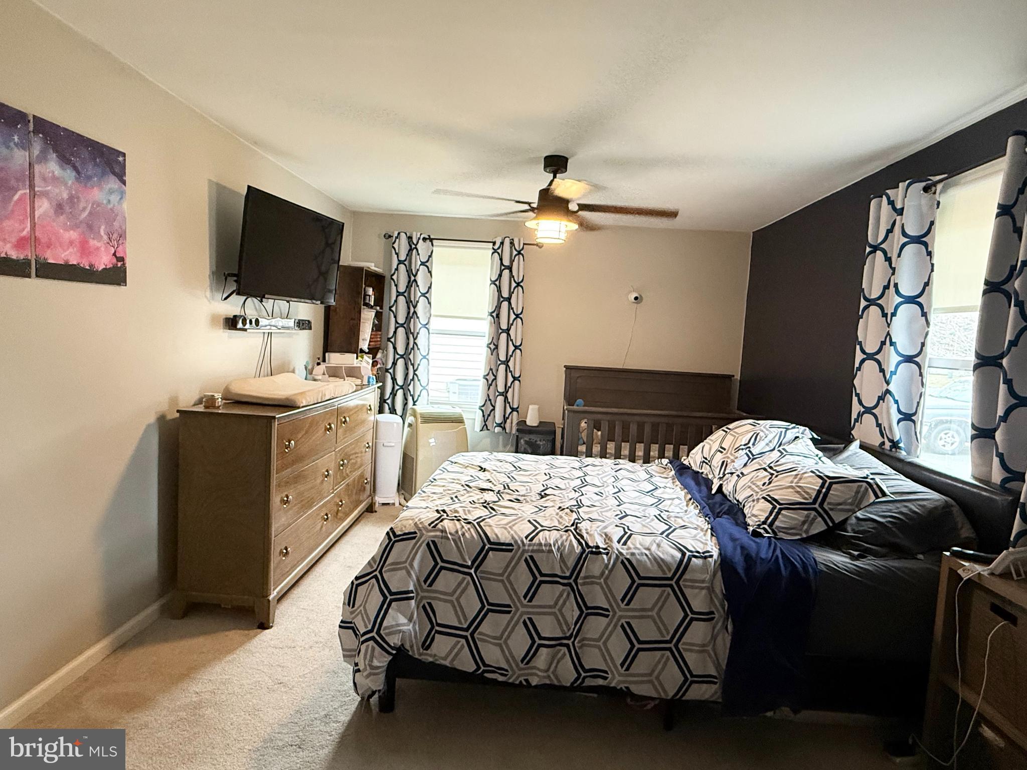 12 North Maple Avenue Ridgely, MD 21660 - Photo 9 of 23 a bedroom with a bed and a flat screen tv