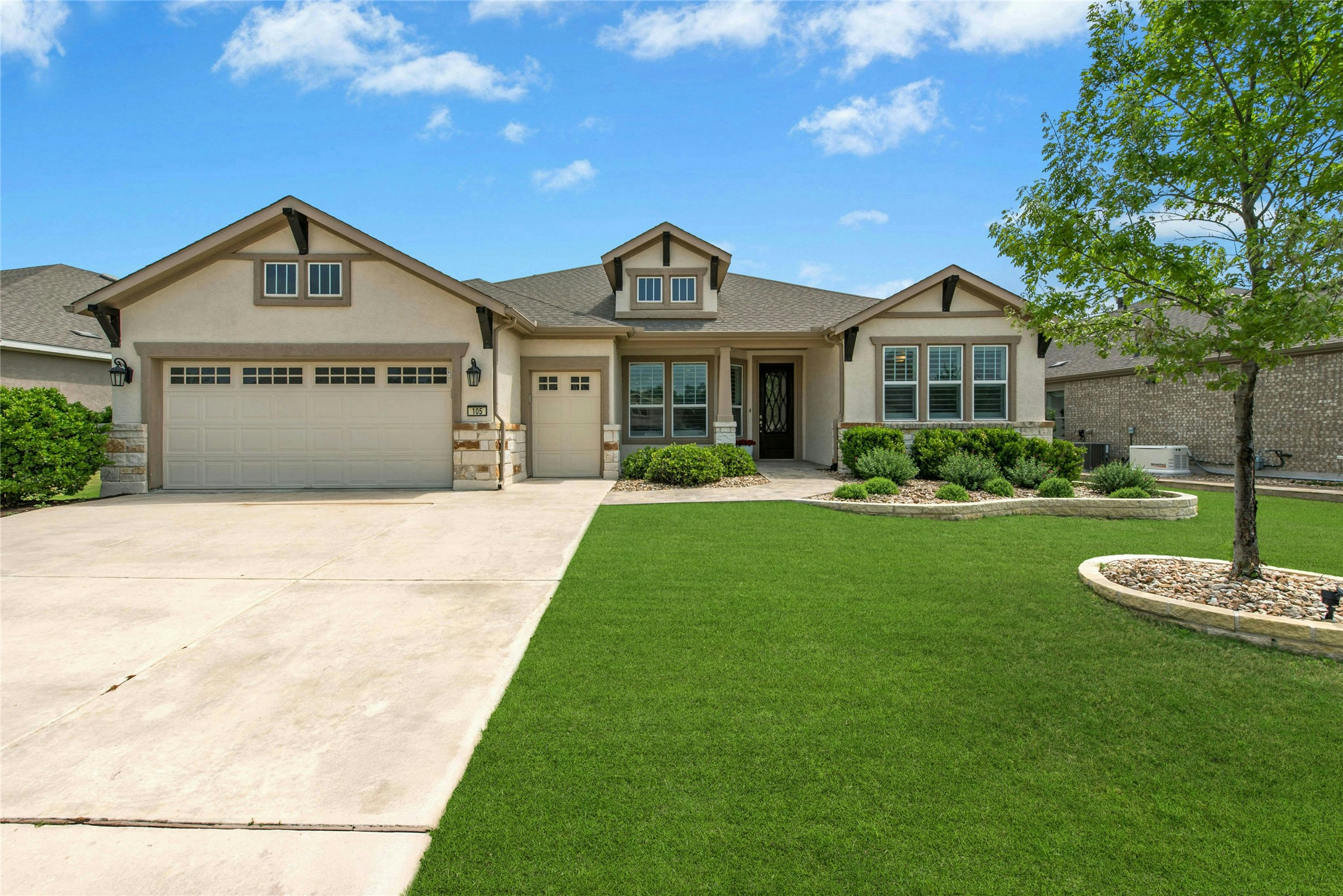 105 Marfa Cove Georgetown, TX 78633 - Photo 2 of 36 a front view of a house with a yard and garage