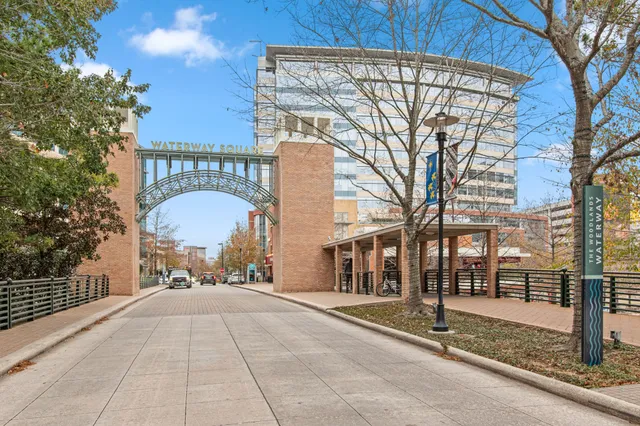 a view of a street with a building in the background