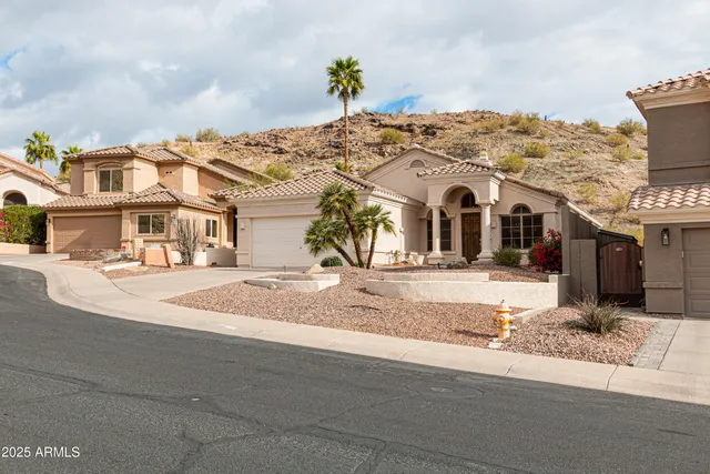 a front view of a house with a snow