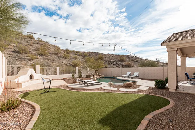 a view of a lake with couches and city view