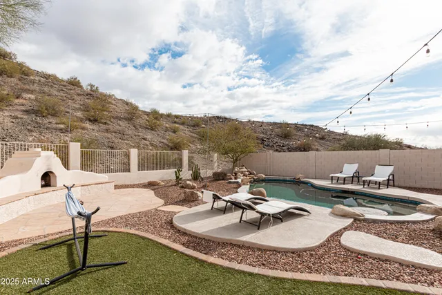 a view of a swimming pool with a patio