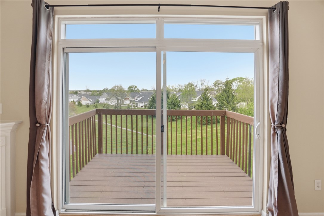 4324 Straight Arrow Road Dayton, OH 45430 - Photo 15 of 40 This living area opens to an expansive deck, perfect for outdoor enjoyment and scenic views.