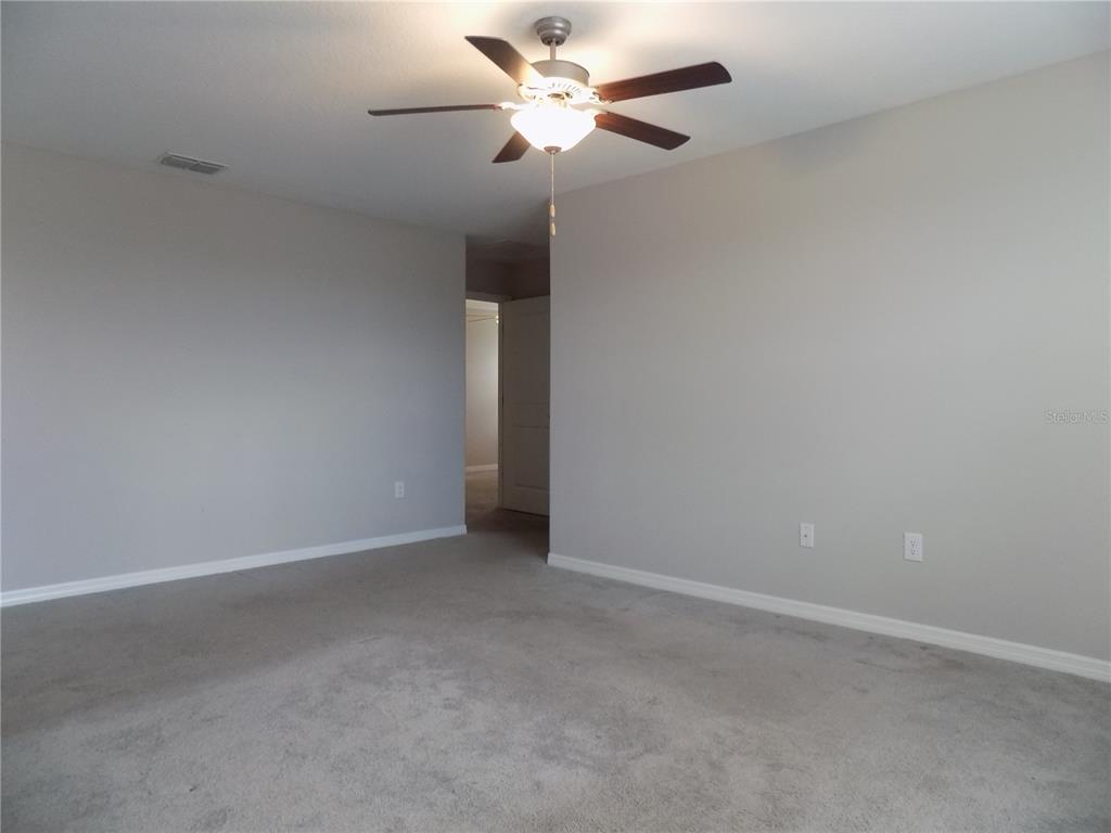 9411 Lemon Drop Loop Sun City Center, FL 33573 - Photo 25 of 47 a view of an empty room
