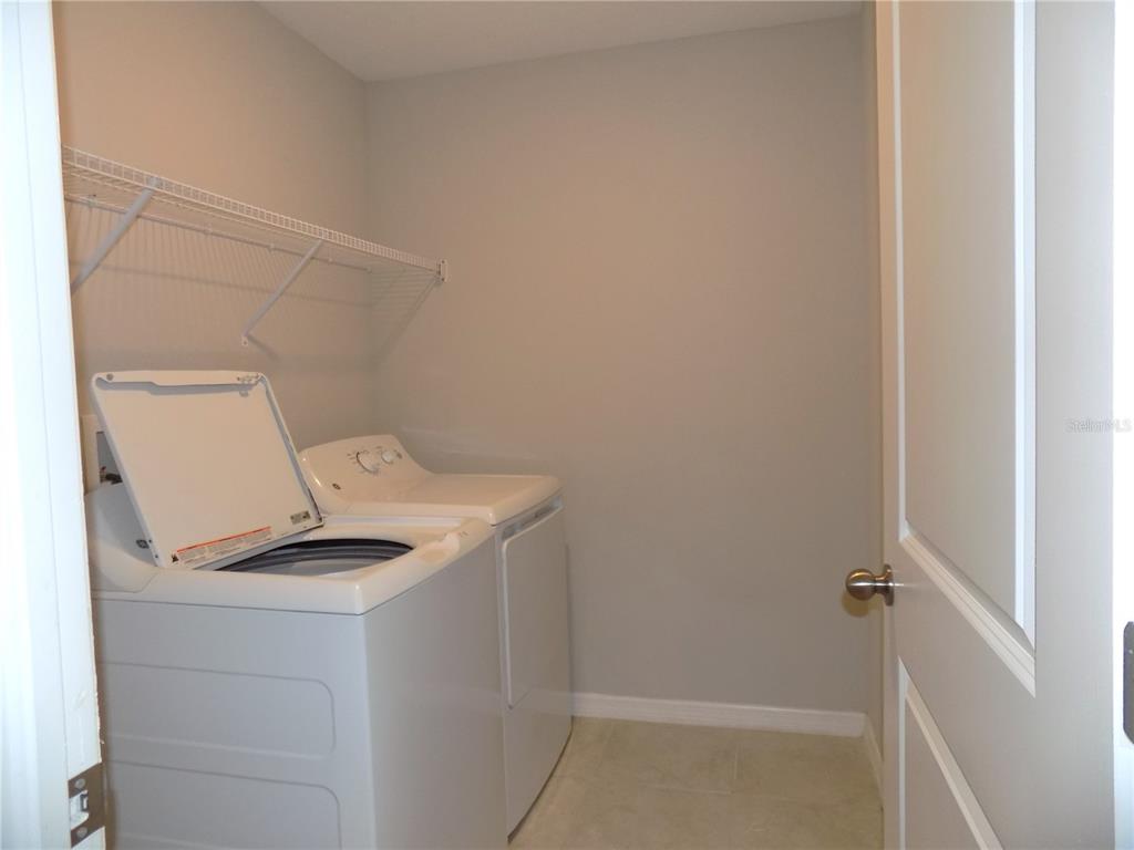 9411 Lemon Drop Loop Sun City Center, FL 33573 - Photo 33 of 47 a bathroom with a sink and toilet