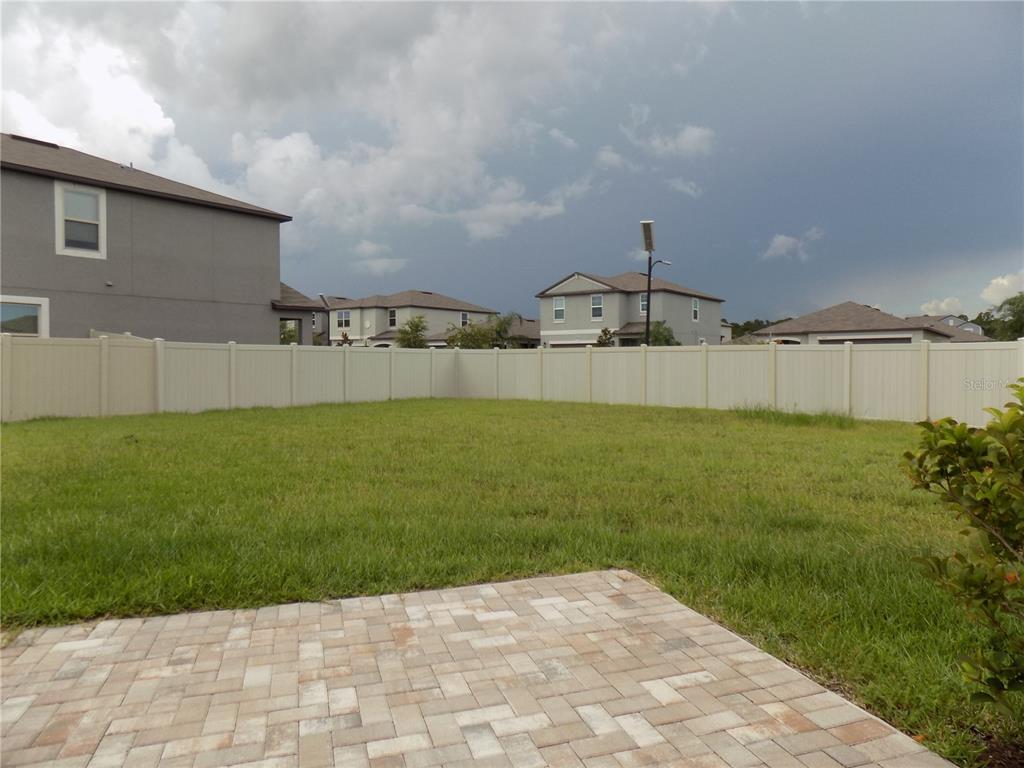 9411 Lemon Drop Loop Sun City Center, FL 33573 - Photo 41 of 47 a view of a back yard of the house