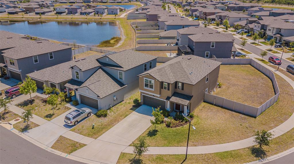 9411 Lemon Drop Loop Sun City Center, FL 33573 - Photo 44 of 47 an aerial view of a house with a swimming pool