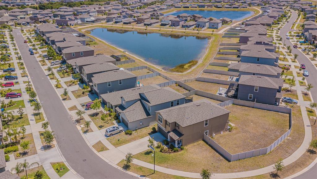 9411 Lemon Drop Loop Sun City Center, FL 33573 - Photo 45 of 47 an aerial view of a house with a swimming pool