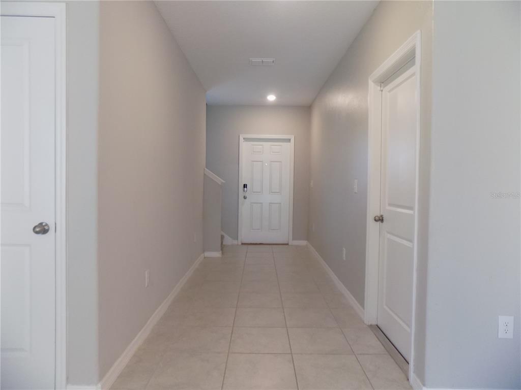9411 Lemon Drop Loop Sun City Center, FL 33573 - Photo 5 of 47 a view of a hallway