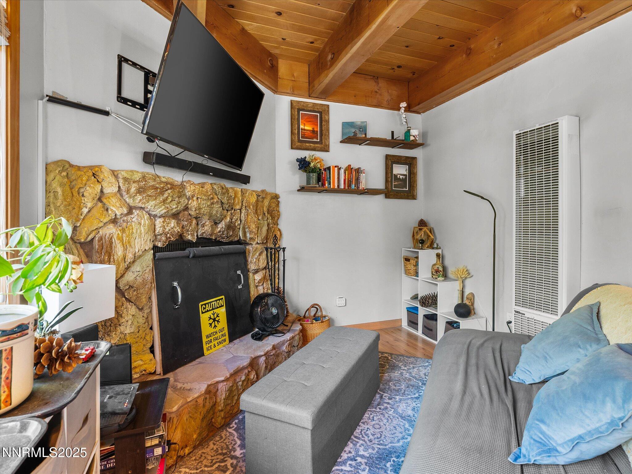 259 Tramway Drive, Unit 4 Stateline, NV 89449 - Photo 12 of 33 a living room with furniture and a flat screen tv