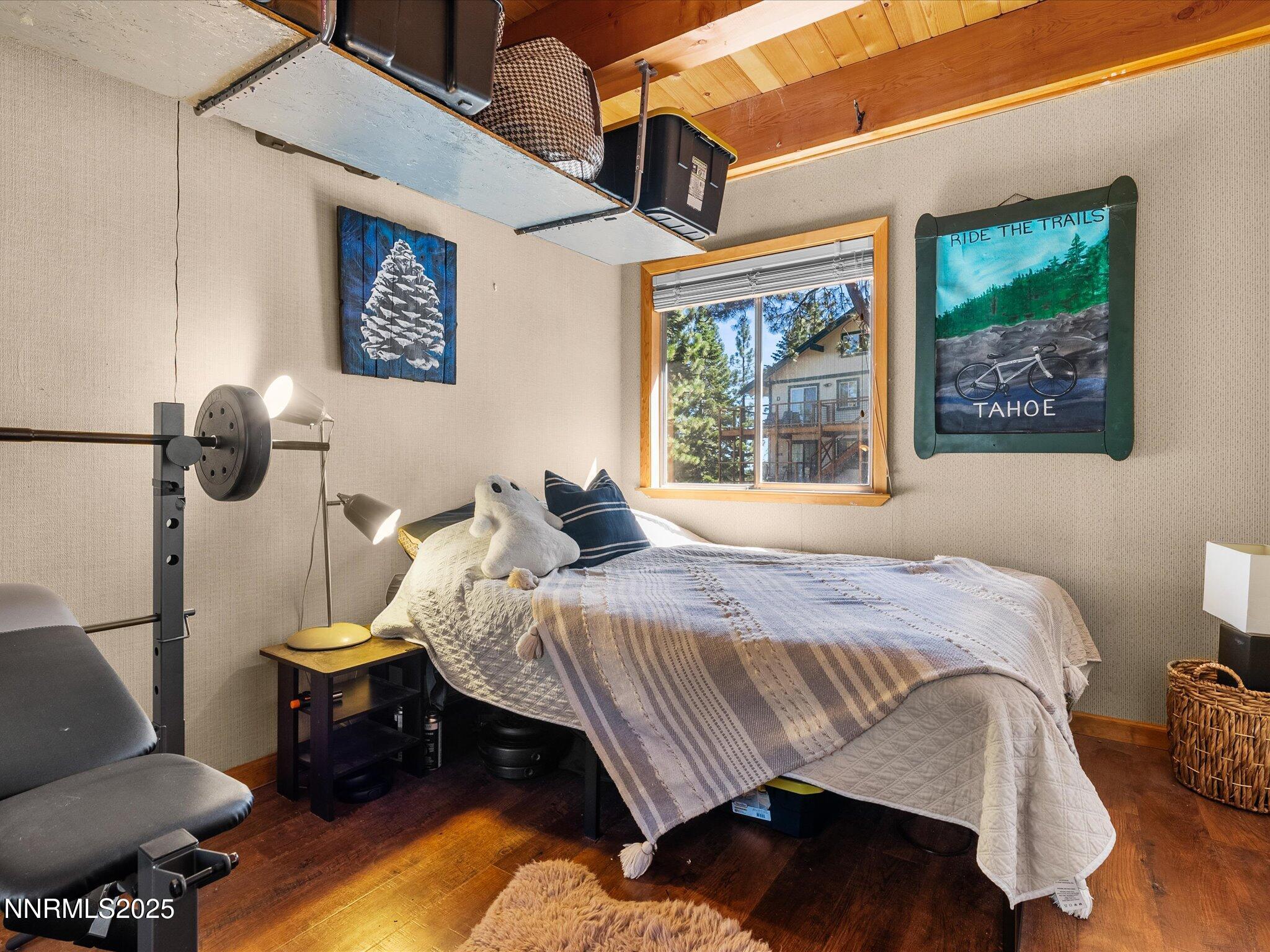 259 Tramway Drive, Unit 4 Stateline, NV 89449 - Photo 14 of 33 a bedroom with a bed and wooden floor