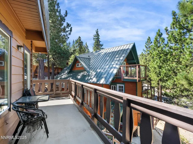 a view of a green field with wooden fence