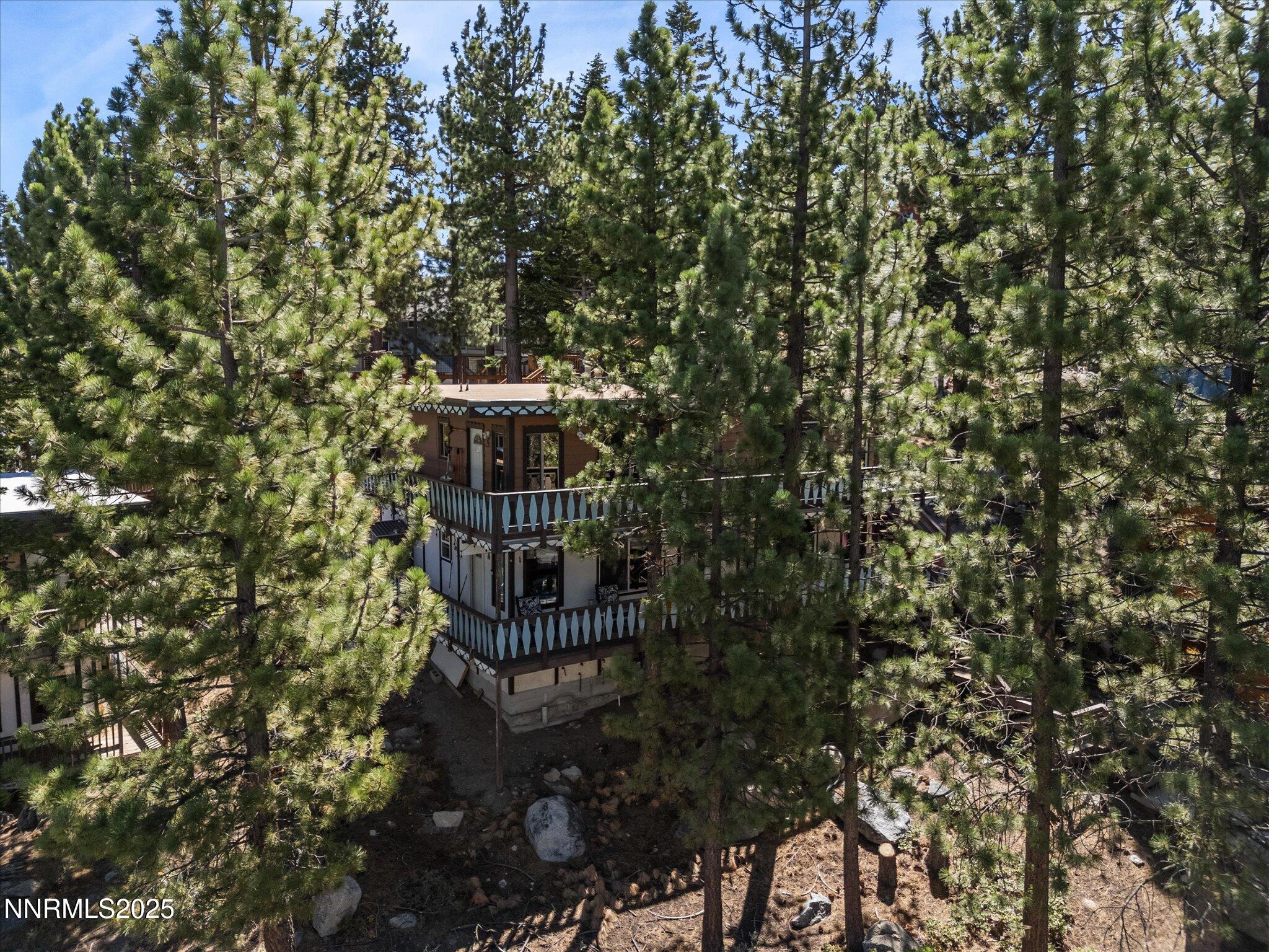 259 Tramway Drive, Unit 4 Stateline, NV 89449 - Photo 26 of 33 a view of a large building with a tree