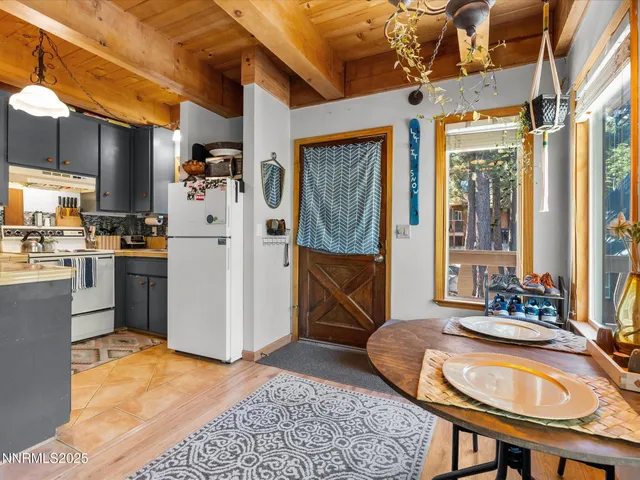 a room with furniture and a kitchen