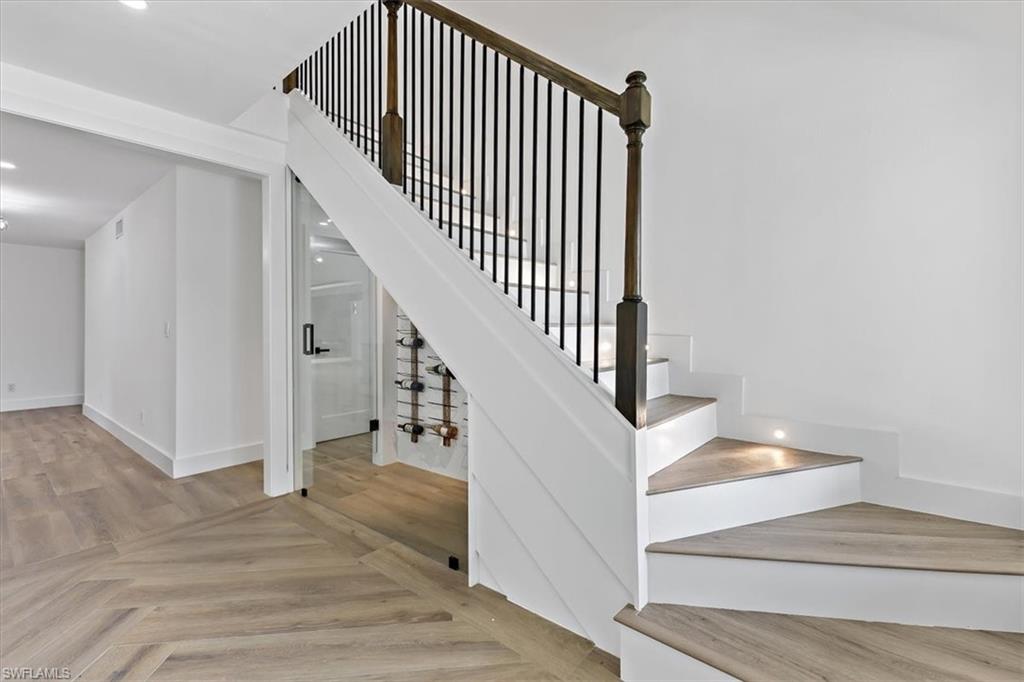 261 13th Street Southwest Naples, FL 34117 - Photo 14 of 35 Staircase with parquet flooring