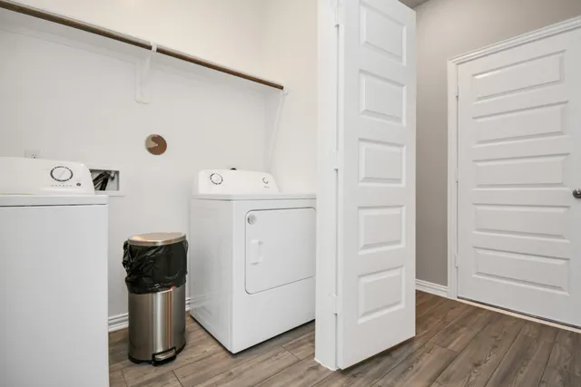 an aerial view of a houses with swimming pool