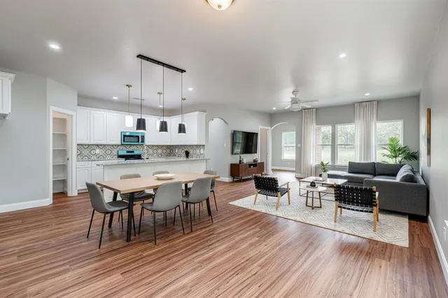 a view of a dining room with furniture and wooden floor