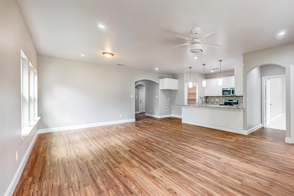 201 Dellis Street Terrell, TX 75160 - Photo 9 of 12 a view of a kitchen with a sink and wooden floor