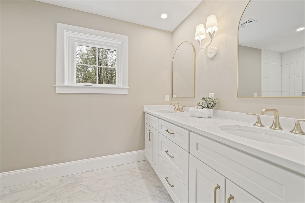 45 Red Gold Farm Road Marshfield, MA 02050 - Photo 20 of 40 a bathroom with double vanity sink and a mirror