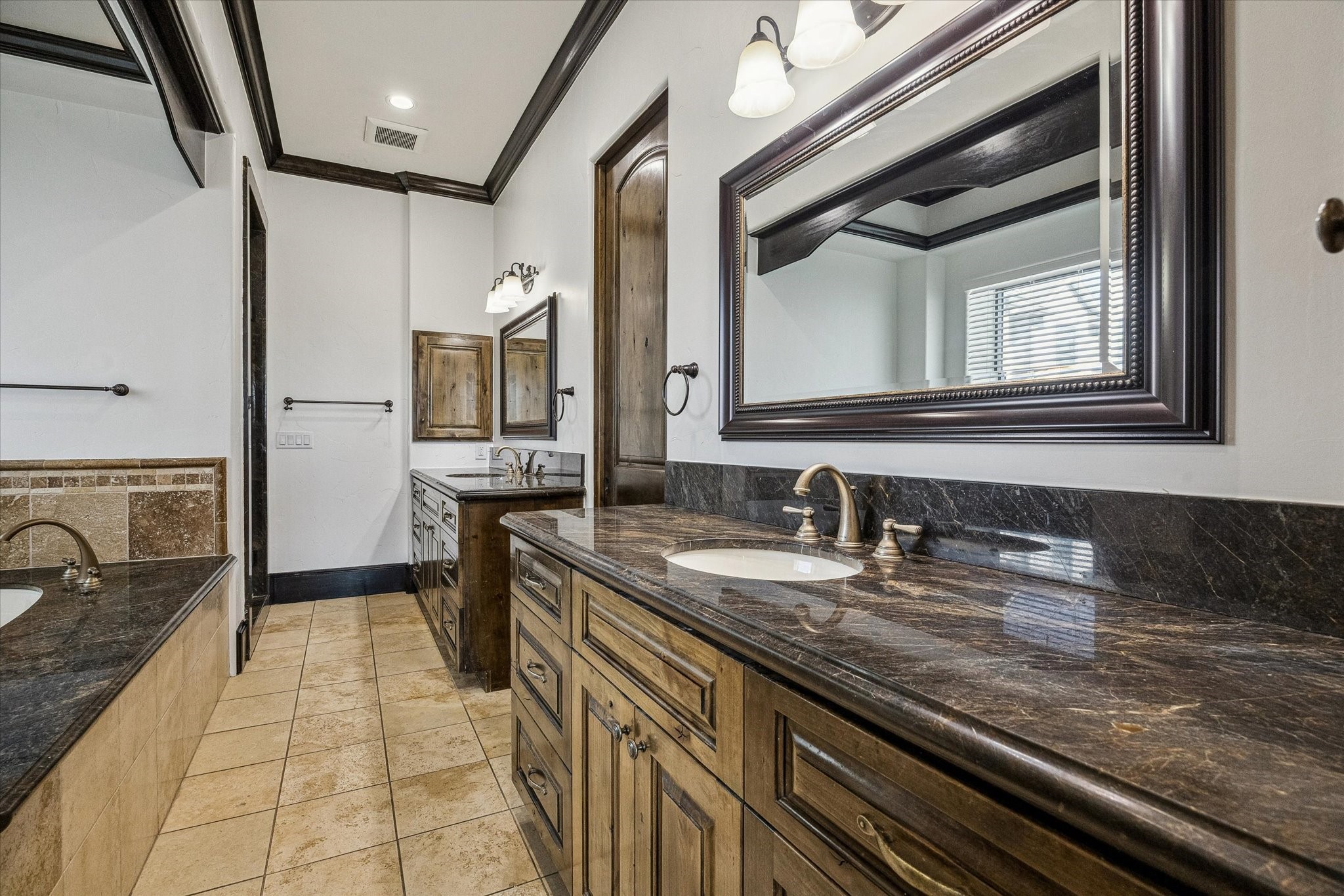 4119 Allen Street Houston, TX 77007 - Photo 26 of 42 Spacious primary bathroom with marble countertops and dual sinks